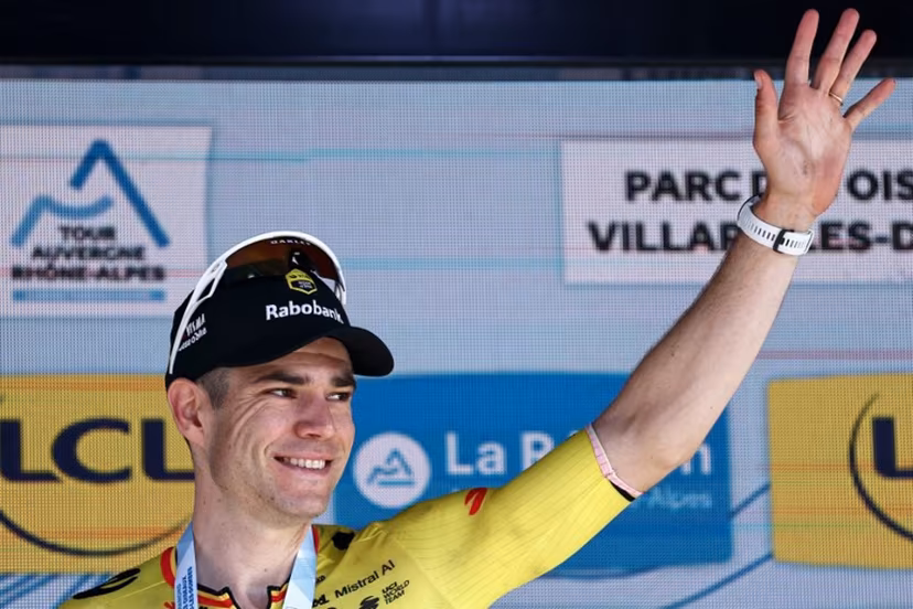Stage winner Team Visma | Lease a Bike's Belgian rider Wout Van Aert celebrates on the podium of the 5th stage of the Tour Auvergne-Rhone-Alpes cycling race (formerly known as the Criterium du Dauphine), 195,8km between Saint-Chamond and Villars-les-Dombes, central France, on June 11, 2026. Anne-Christine POUJOULAT / AFP