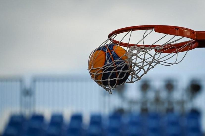 The ball is pictured entering the basket during the women's first round 3x3 basketball match between France and Romania at the Aomi Urban Sports Park in Tokyo, on July 27, 2021 during the Tokyo 2020 Olympic Games. Ina FASSBENDER / AFP
