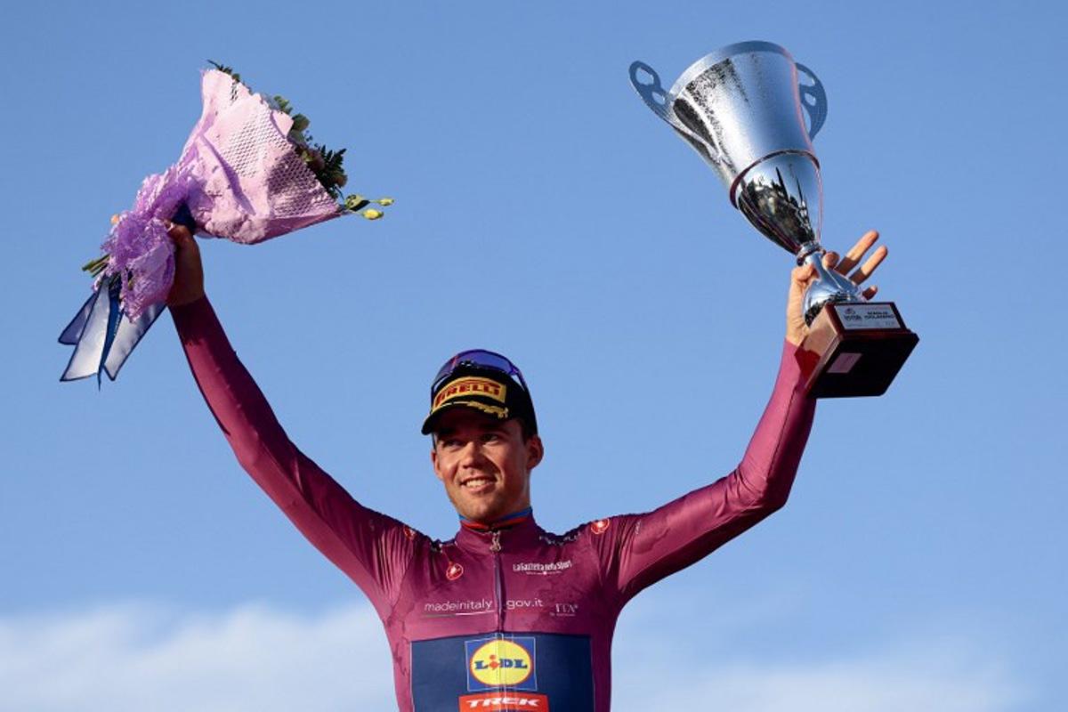 Lidl-Trek's Danish rider Mads Pedersen wearing the cyclamen jersey of best sprinter (Maglia Ciclamino) celebrates on the podium after the 21st and last stage of the 108th Giro d'Italia cycling race of 143kms from Rome to Rome on June 1, 2025. Luca Bettini / AFP