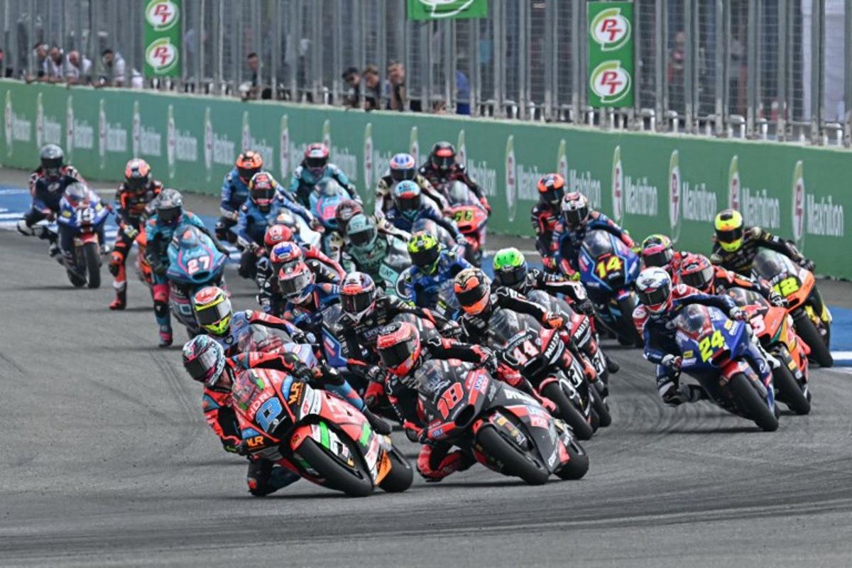 Riders take the start of the Moto2 race at the MotoGP Thailand Grand Prix at the Buriram International Circuit in Buriram on March 2, 2025. MOHD RASFAN / AFP