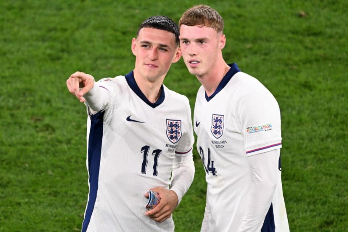 England's midfielder #11 Phil Foden and England's midfielder #24 Cole Palmer celebrate at the end of the UEFA Euro 2024 semi-final football match between the Netherlands and England at the BVB Stadion in Dortmund on July 10, 2024. Kirill KUDRYAVTSEV / AFP
