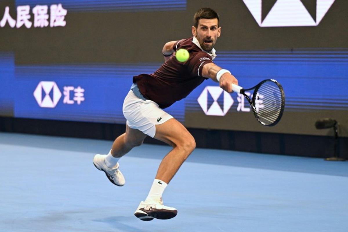 Serbia's Novak Djokovic hits a return to Russia's Daniil Medvedev during their men's singles semi-final at the China Open tennis tournament in Beijing on October 5, 2026. Greg Baker / AFP