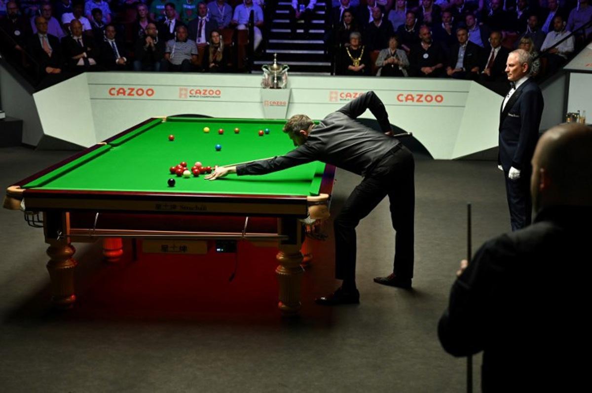 England's Mark Selby plays a shot against Belgium's Luca Brecel during the evening session on day two of their World Championship Snooker final match at The Crucible in Sheffield, northern England on May 1, 2023. Oli SCARFF / AFP