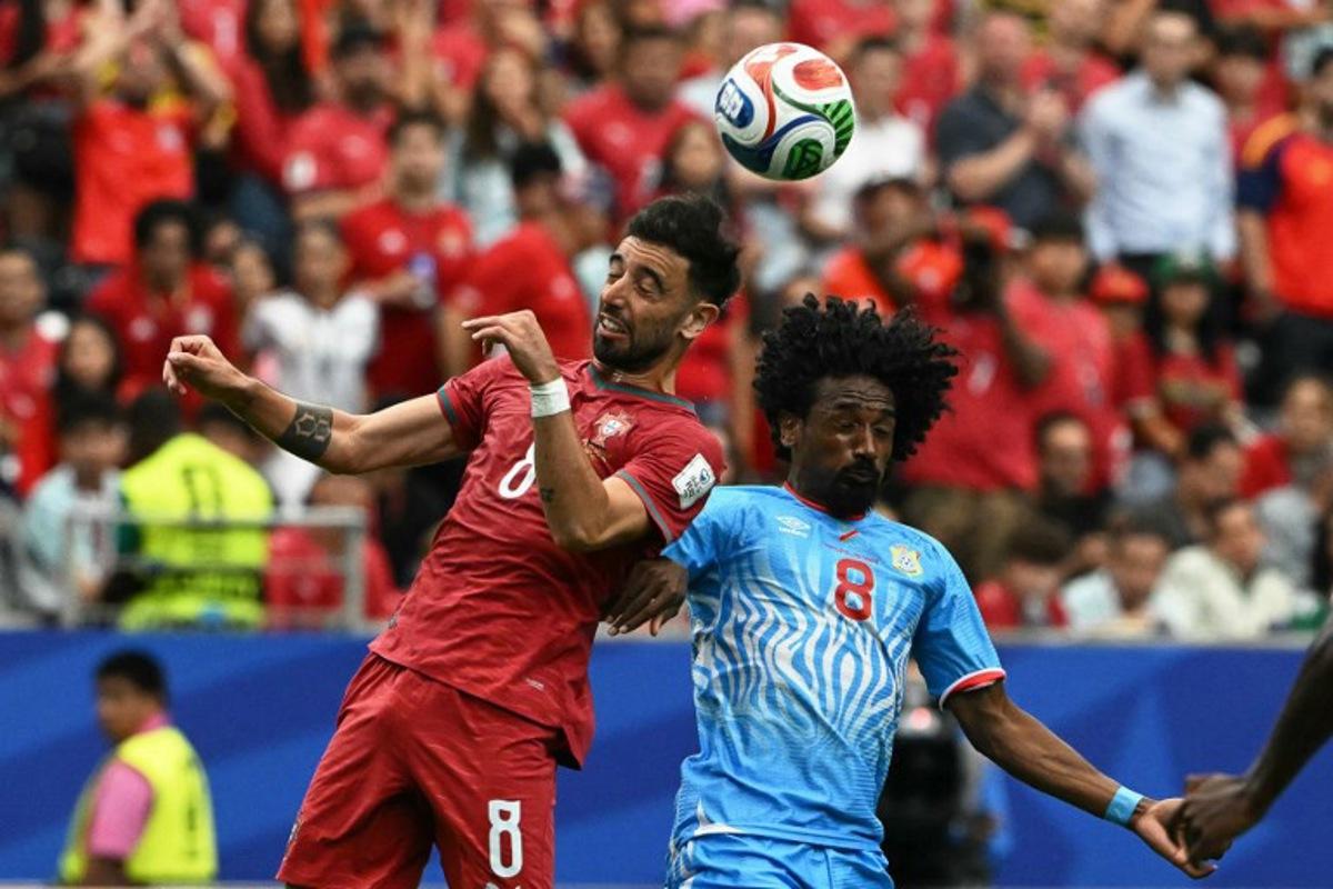 Portugal's midfielder #08 Bruno Fernandes (L) fights for the ball with Congo DR's midfielder #08 Samuel Moutoussamy during the 2026 World Cup Group K football match between Portugal and the Democratic Republic of Congo at the Houston Stadium in Houston on June 17, 2026. RONALDO SCHEMIDT / AFP