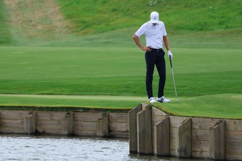 Belgium's Adrien Dumont de Chassart looks on after his ball fell in the water in round 3 of the men's golf individual stroke play of the Paris 2024 Olympic Games at Le Golf National in Guyancourt, south-west of Paris on August 3, 2024. Emmanuel DUNAND / AFP