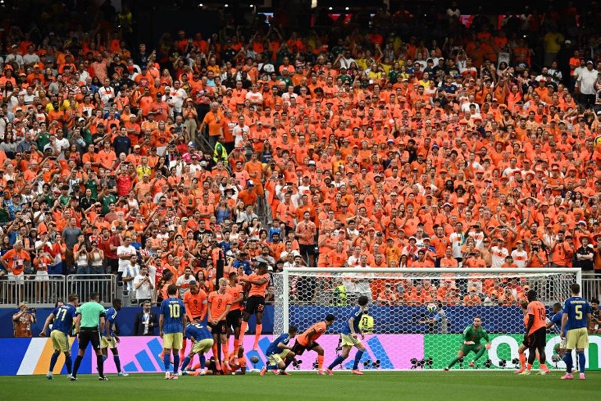 Netherlands' players jump to block a free kick by Sweden's forward #17 Viktor Gyokeres (L) during the 2026 World Cup Group F football match between the Netherlands and Sweden at the Houston Stadium in Houston on June 20, 2026. Paul ELLIS / AFP