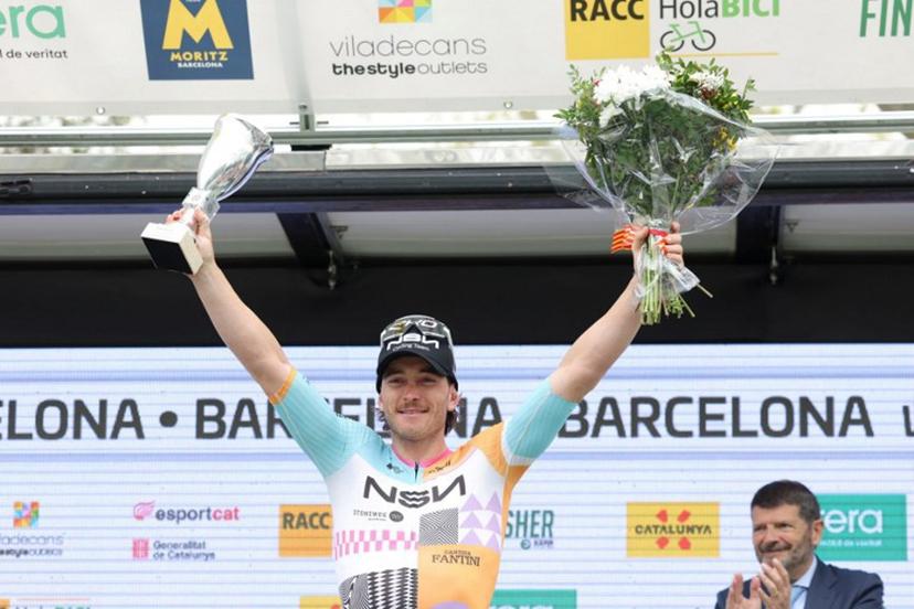 Team NSN Cycling Team's Australian rider Brady Gilmore celebrates on the podium winning the seventh and last stage of the 2026 'Volta a Catalunya' cycling tour of Catalonia, a 95,1 km race between Barcelona and Barcelona, on March 29, 2026. Josep LAGO / AFP
