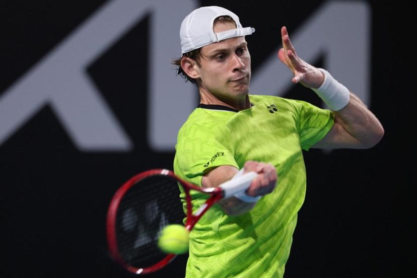 Belgium's Zizou Bergs hits a shot against Poland's Hubert Hurkacz during their men's singles match on day three of the Australian Open tennis tournament in Melbourne on January 20, 2026. IZHAR KHAN / AFP