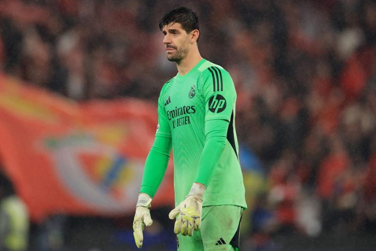 Real Madrid's Belgian goalkeeper #01 Thibaut Courtois gestures at the end of the UEFA Champions League league phase day 8 football match between SL Benfica and Real Madrid CF at Estadio da Luz in Lisbon on January 28, 2026. PATRICIA DE MELO MOREIRA / AFP
