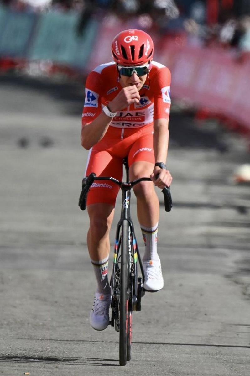 Team UAE's Slovenian rider Tadej Pogacar cycles during the seventh stage of the Vuelta a Espana 2026 on August 28, 2026. Race leader Tadej Pogacar pulled out of the Vuelta a Espana on Saturday after a heavy fall 31km from the finish of a flat stage eight left him with shoulder and face injuries. Pogacar of Team UAE has won five Tour de France titles and a Giro d'Italia and was targetig his first overall victory on the Spanish 21-day race. JOSE JORDAN / AFP