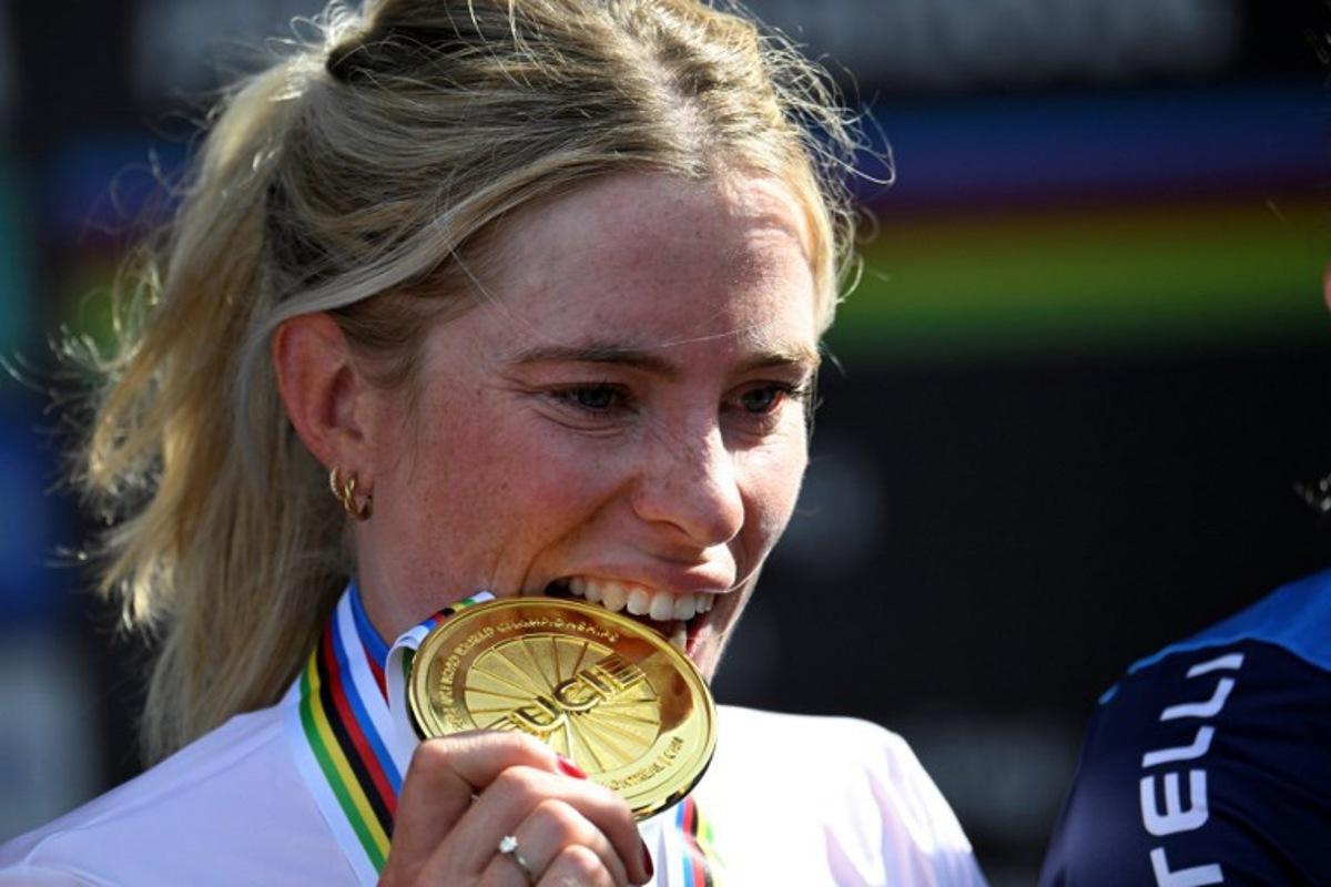 First-placed Demi Vollering of the Netherlands poses on the podium after the Women's Elite Road Race at the 2026 Union Cycliste Internationale (UCI) Road World Championships in Montreal, Quebec, on September 26, 2026. Andrej Ivanov / AFP