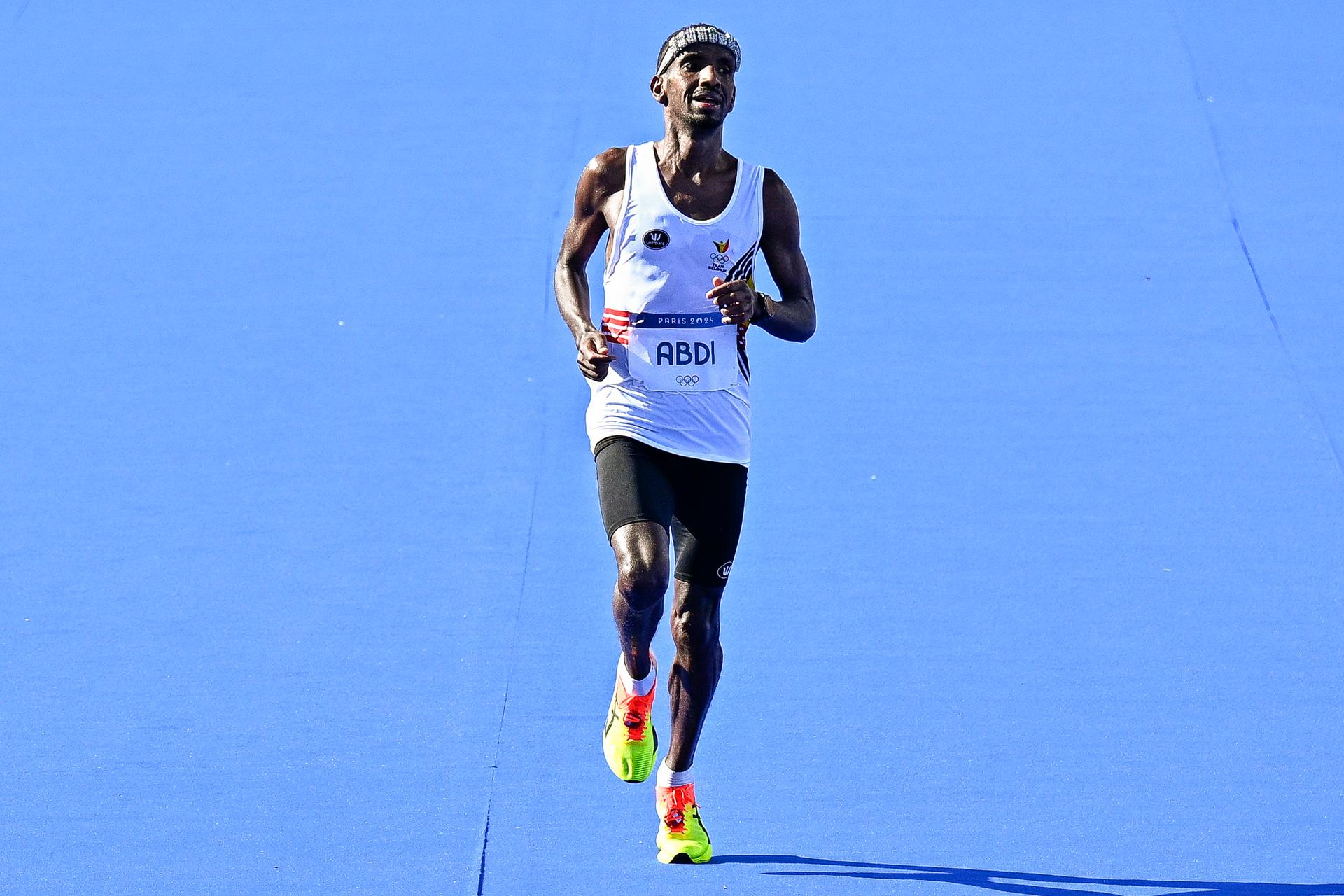 Belgian athlete Bashir Abdi crosses the finish line to win the silver medal of the men's marathon of the athletics competition at the Paris 2024 Olympic Games, on Saturday 10 August 2024 in Paris, France. The Games of the XXXIII Olympiad are taking place in Paris from 26 July to 11 August. The Belgian delegation counts 165 athletes competing in 21 sports. BELGA PHOTO JASPER JACOBS