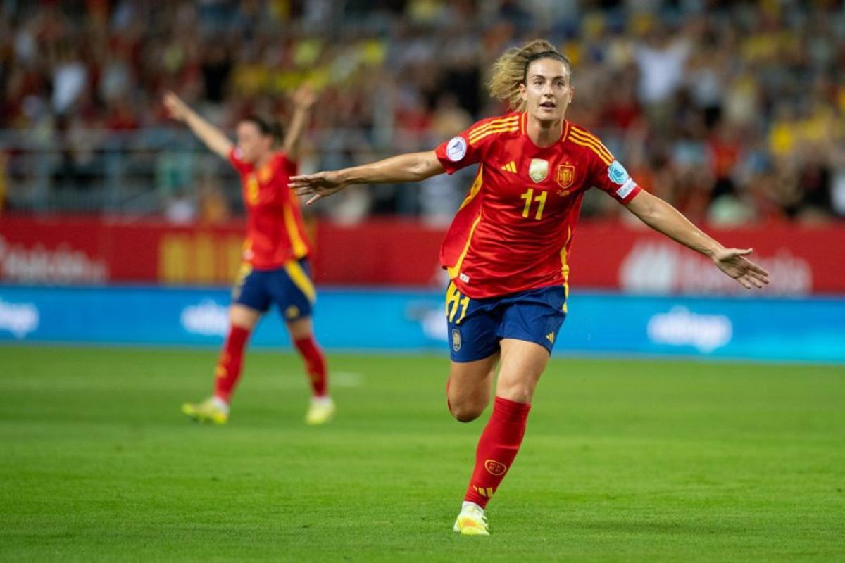 Spain's midfielder #11 Alexia Putellas celebrates scoring the opening goal during the UEFA Women's Nations League semi-final football match between Spain and Sweden at La Rosaleda stadium in Malaga on October 24, 2025. JORGE GUERRERO / AFP