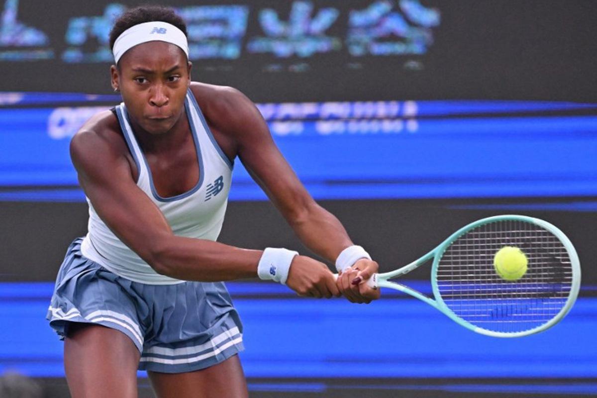 USA's Coco Gauff hits a return to Italy's Jasmine Paolini during their women's singles semi-final match at the Wuhan Open tennis tournament in Wuhan, Central China's Hubei province on October 11, 2025. ADEK BERRY / AFP