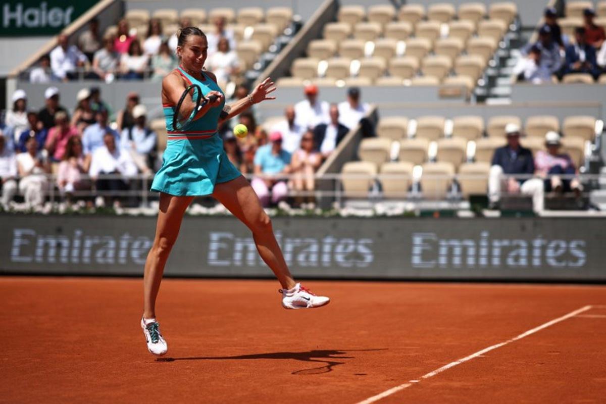 Belarus' Aryna Sabalenka plays a forehand return to China's Zheng Qinwen during their quarter-final women's singles match on day 10 of the French Open tennis tournament on Court Philippe-Chatrier at the Roland-Garros Complex in Paris on June 3, 2025. Anne-Christine POUJOULAT / AFP