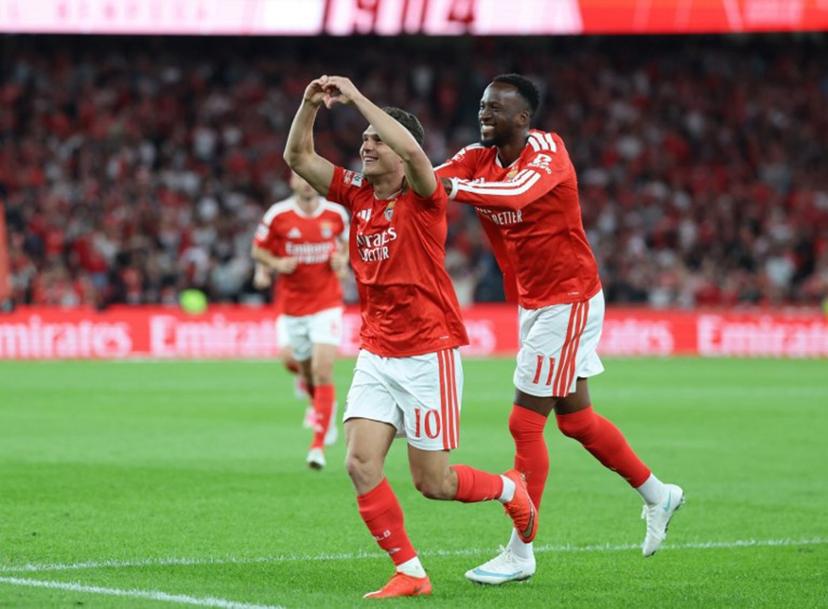 Benfica's Ukrainian midfielder #10 Georgiy Sudakov celebrates with Benfica's Belgian forward #11 Dodi Lukebakio scoring his team's second goal during the Portuguese League football match between SL Benfica and Vitoria Guimaraes SC at Estadio da Luz in Lisbon on October 11, 2026. PATRICIA DE MELO MOREIRA / AFP