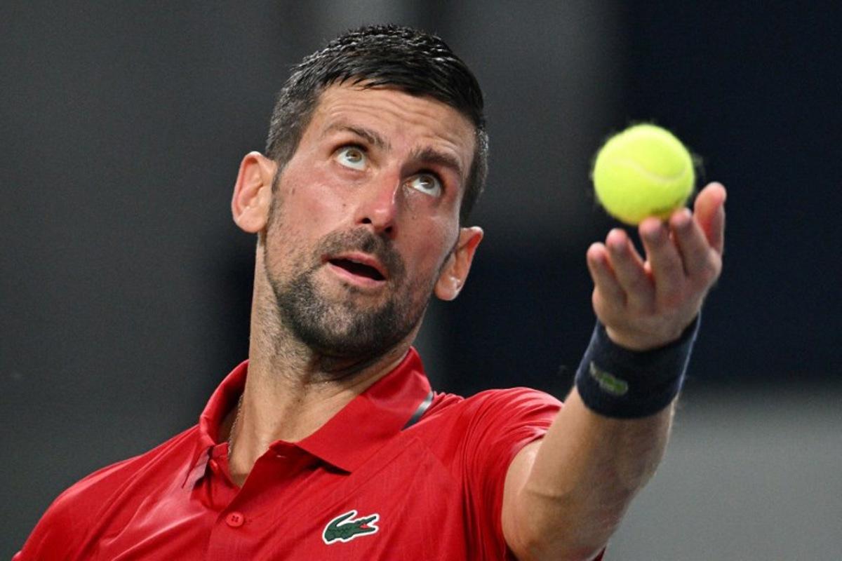 Serbia's Novak Djokovic serves to Monaco's Valentin Vacherot during their men's singles semi-final match at the Shanghai Masters tennis tournament in Shanghai on October 11, 2025. Hector RETAMAL / AFP