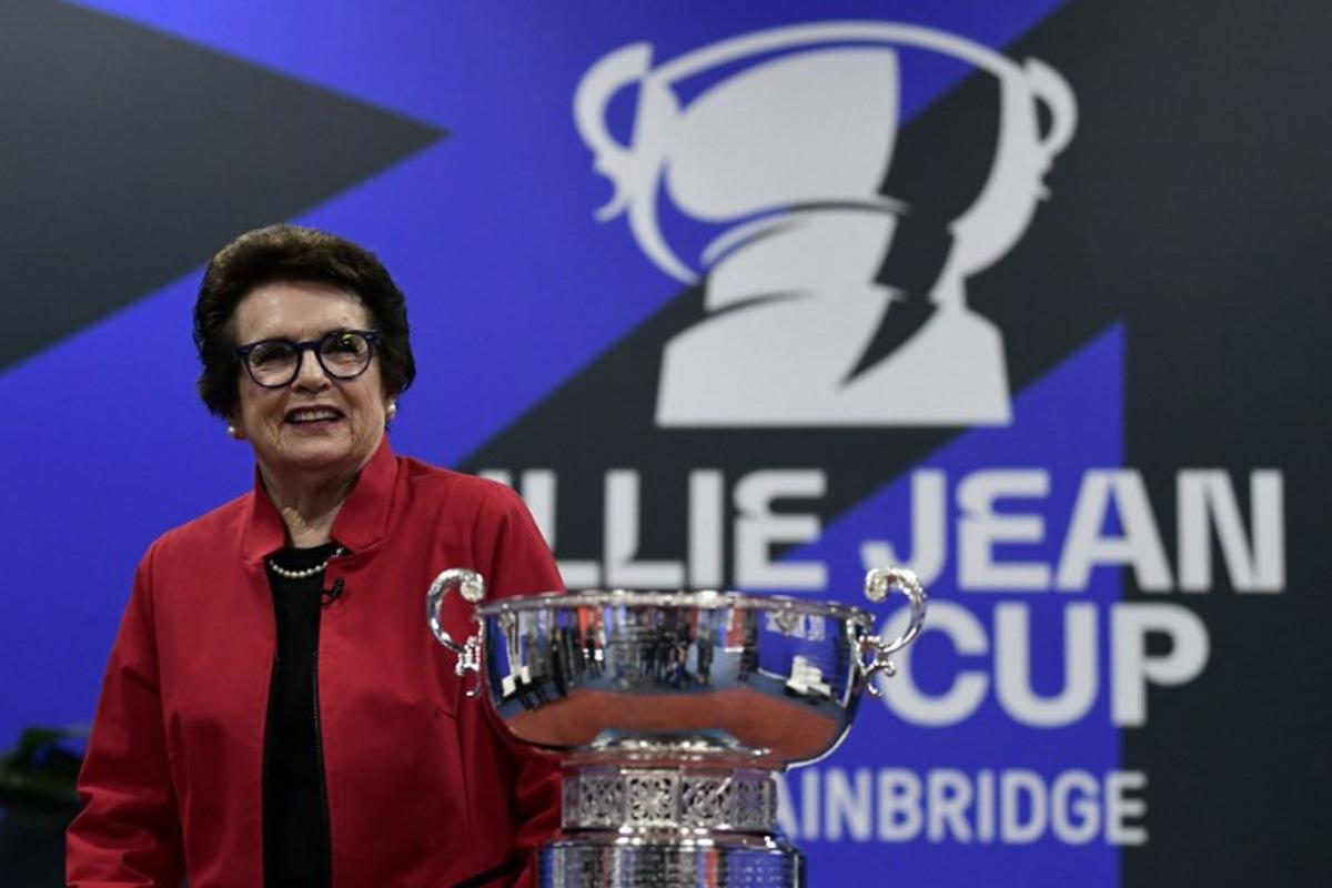 US tennis star Billie Jean King poses next to the tournament's trophy, on the day 2 of the Billie Jean King Cup Finals 2023 in La Cartuja stadium in Seville on November 8, 2023. CRISTINA QUICLER / AFP