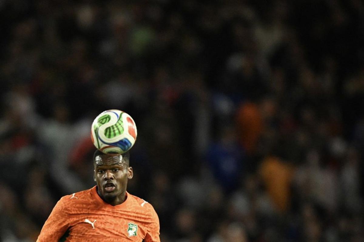 Ivory Coast's forward #09 Ange-Yoan Bonny eyes the ball during the international friendly football match between France and Ivory Coast ahead of the 2026 FIFA World Cup football tournament at the Stade de la Beaujoire in Nantes, western France, on June 4, 2026. Loic VENANCE / AFP