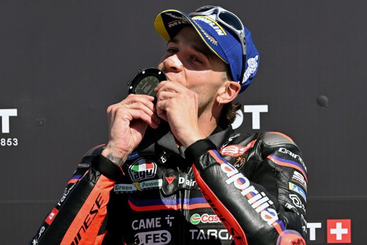 Aprilia Racing team's Italian MotoGP rider Marco Bezzecchi celebrates winning the MotoGP sprint race at the MotoGP Australian Grand Prix on Philip Island on October 18, 2025. William WEST / AFP