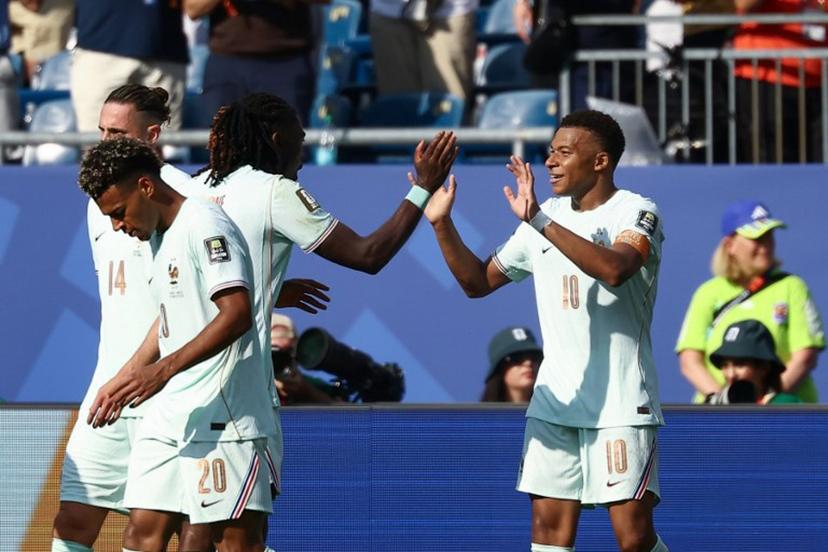 France's forward #10 Kylian Mbappe (R) celebrates scoring his team's first goal during the 2026 World Cup football tournament quarter-final match between France and Morocco at Boston Stadium in Foxborough on July 9, 2026. CHARLY TRIBALLEAU / AFP