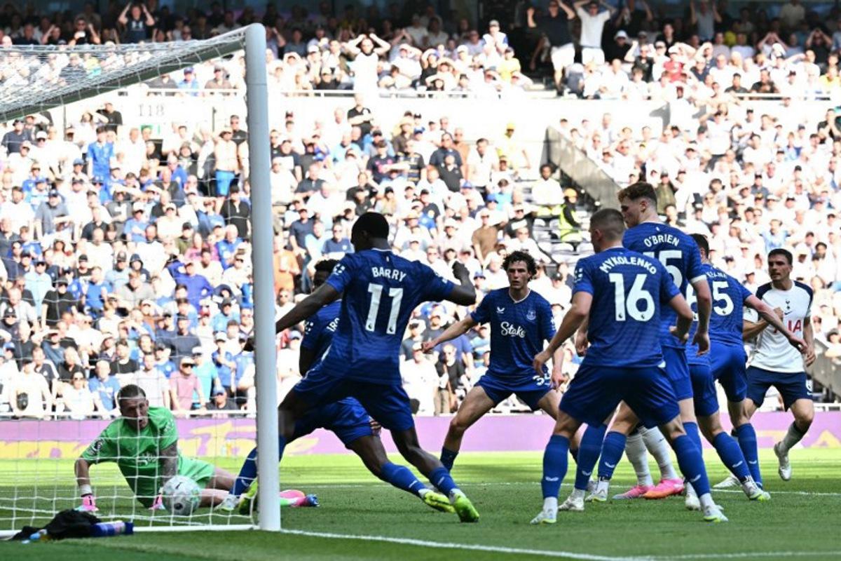 Tottenham Hotspur's Portugese midfielder #06 Joao Palhinha (R) sees his shot cross the West Ham goal-line for the opening goal of the English Premier League football match between Tottenham Hotspur and Everton at the Tottenham Hotspur Stadium in London, on May 24, 2026. Ben STANSALL / AFP