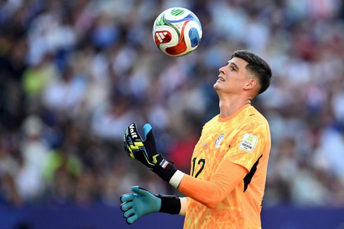 Paraguay's goalkeeper #12 Orlando Gill controls the ball during the 2026 World Cup round of 16 football match between Paraguay and France at the Philadelphia Stadium in Philadelphia on July 4, 2026. MAURO PIMENTEL / AFP