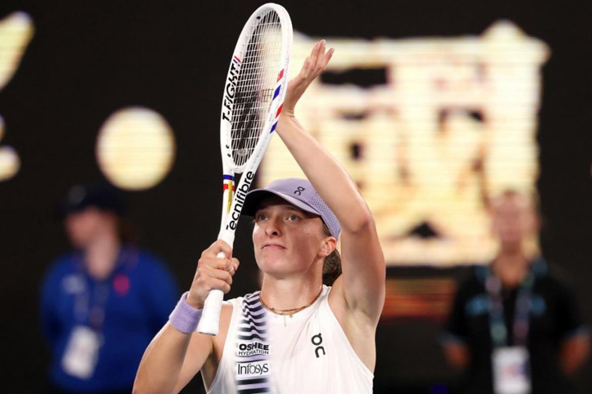 Poland's Iga Swiatek celebrates victory over China's Yuan Yue after their women's singles match on day two of the Australian Open tennis tournament in Melbourne on January 19, 2026. DAVID GRAY / AFP