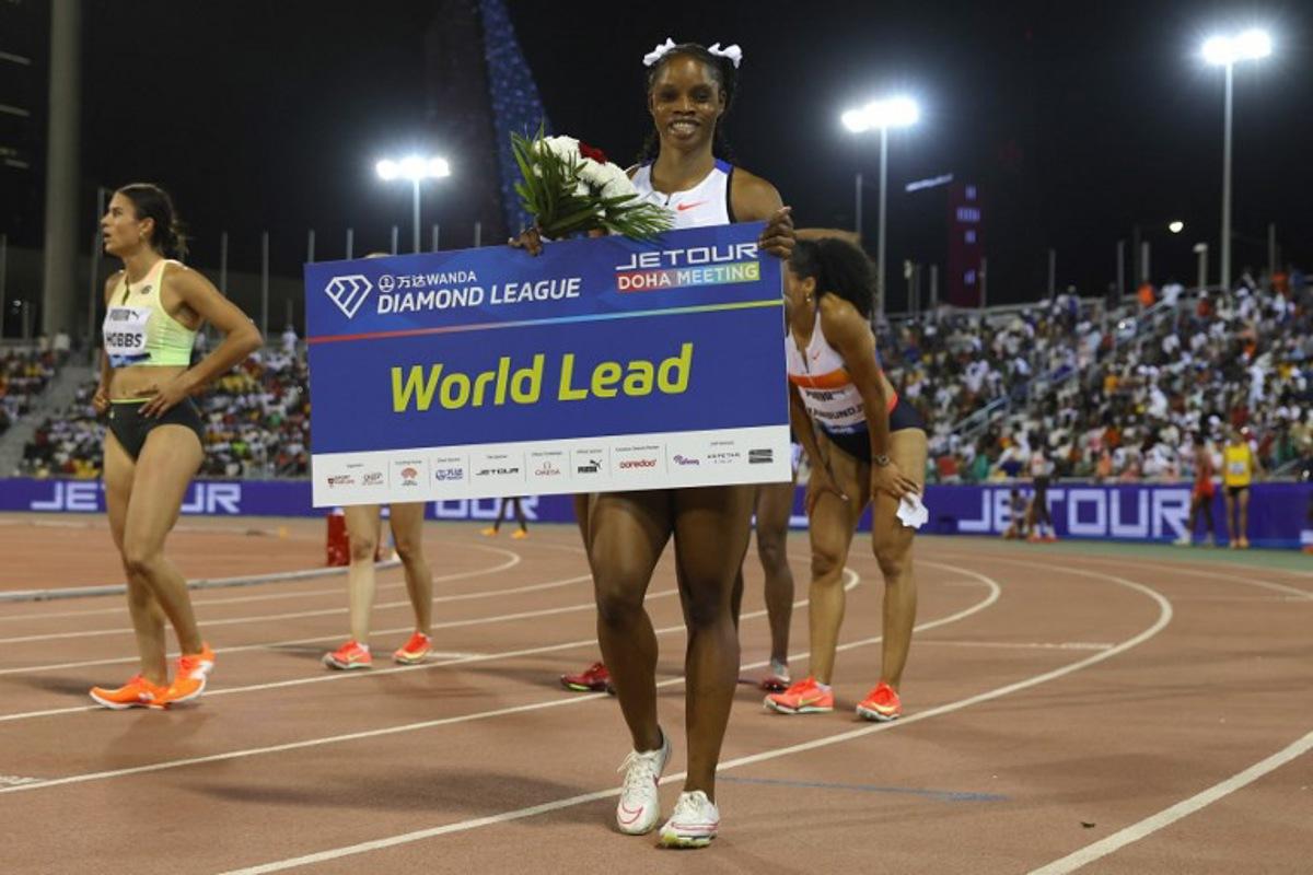 Jamaica's Tia Clayton celebrates after winning the women's 100m final during the IAAF Diamond League competition at the Suheim Bin Hamad Stadium in Doha on May 16, 2025. Karim JAAFAR / AFP