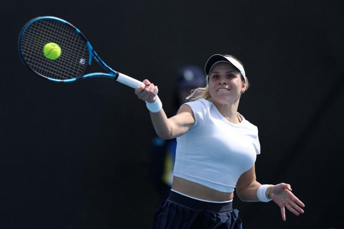 Croatia's Jana Fett hits a return against Britain's Harriet Dart during their women's singles match on day two of the Australian Open tennis tournament in Melbourne on January 13, 2025. Adrian Dennis / AFP