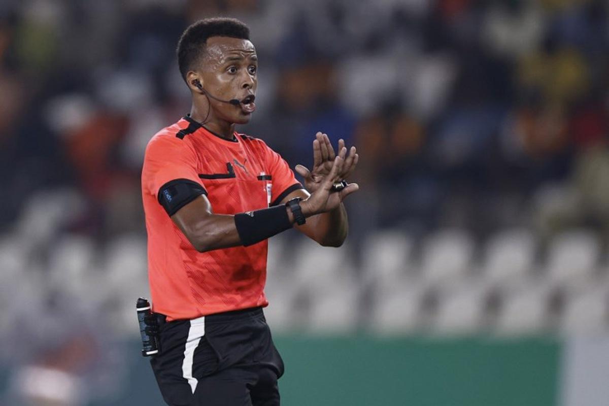 (FILES) Somalian referee Omar Abdulkadir Artan gestures during the Africa Cup of Nations (CAN) 2024 group D football match between Mauritania and Algeria at Stade de la Paix in Bouake on January 23, 2024. Award-winning Somali referee Omar Artan, set to be the first from his country to officiate at the World Cup, was denied entry to the United States, a sports ministry official told AFP on June 8, 2026. "Denying him entry to the United States and preventing him from officiating scheduled matches harms not only him personally but also undermines football's commitment to fairness, merit, and the spirit of fair play," Ciise Aden Abshir, a senior advisor to Somalia's Ministry of Youth and Sports and a former national team captain, told AFP. KENZO TRIBOUILLARD / AFP