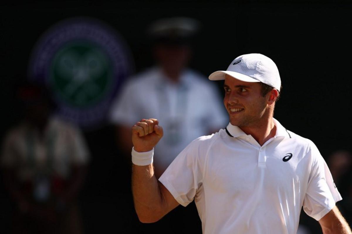 Britain's Arthur Fery celebrates winning a point against Italy's Flavio Cobolli during their men's singles quarter-final tennis match on the tenth day of the 2026 Wimbledon Championships at The All England Lawn Tennis and Croquet Club in Wimbledon, southwest London, on July 8, 2026. Henry Nicholls / AFP