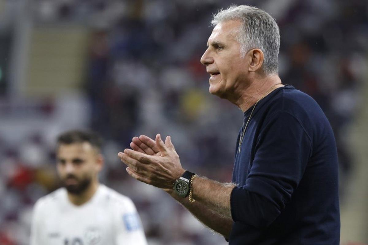 Qatar's Portuguese coach Carlos Queiroz speaks to his players during the 2026 FIFA World Cup AFC qualifiers football match between Qatar and Afghanistan at the Khalifa International Stadium on November 16, 2023. KARIM JAAFAR / AFP