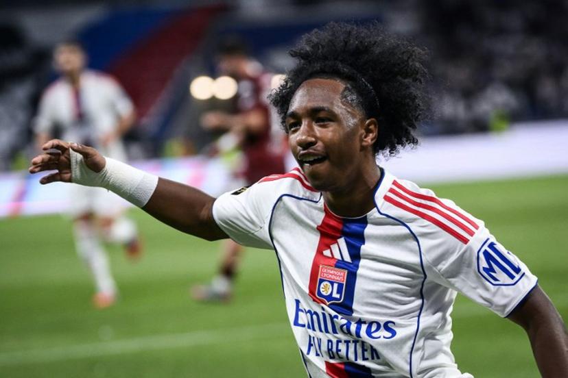 Lyon's Belgian forward #11 Malick Fofana (C) celebrates after scoring a goal during the French L1 football match between Olympique Lyonnais (OL) and FC Metz at the Groupama Stadium in Decines-Charpieu, central-eastern France on August 23, 2025. ARNAUD FINISTRE / AFP