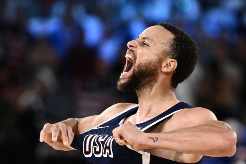USA's #04 Stephen Curry celebrates scoring a three-point field goal in the men's Gold Medal basketball match between France and USA during the Paris 2024 Olympic Games at the Bercy Arena in Paris on August 10, 2024. Aris MESSINIS / AFP