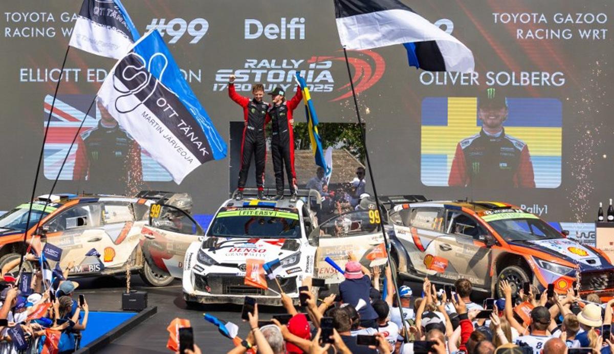 Winners Swedish Oliver Solberg (R) and his British co-driver Elliott Edmondson celebrate on the podium after winning the Rally Estonia, the eighth round of the FIA World Rally Championship, on July 20, 2025 in Kaariku, Estonia. TIMO ANIS / AFP