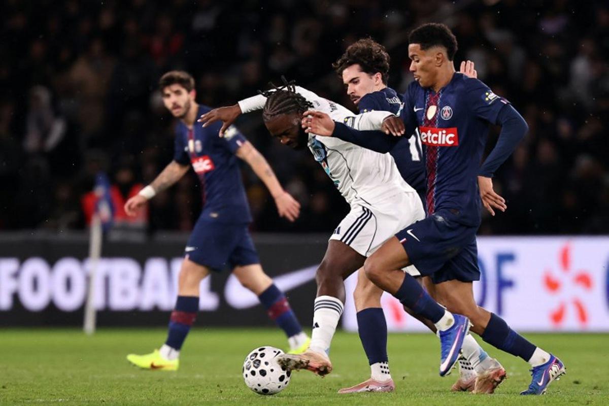 Paris FC's French midfielder #14 Jonathan Ikone (C) fights for the ball with Paris Saint-Germain's Portuguese midfielder #10 Vitinha (2R) and Paris Saint-Germain's French midfielder #03 Senny Mayulu (R) during the French Cup round of 32 football match between between Paris Saint-Germain (PSG) and Paris FC at the Parc des Princes stadium in Paris on January 12, 2026. Anne-Christine POUJOULAT / AFP