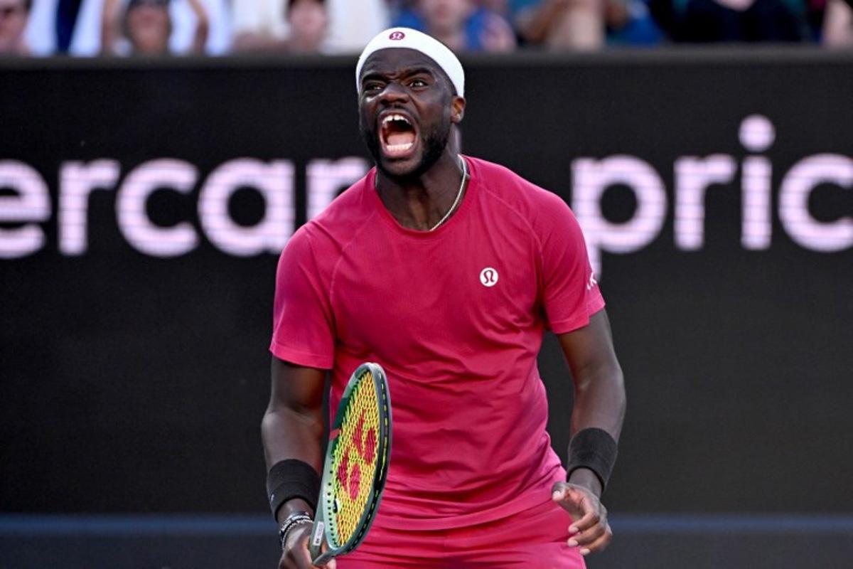 Hungary's Fabian Marozsan reacts on a point against USA's Frances Tiafoe during their men's singles match on day five of the Australian Open tennis tournament in Melbourne on January 16, 2025. WILLIAM WEST / AFP