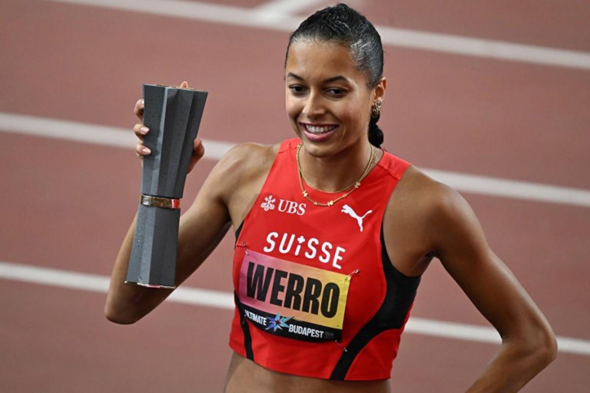 Switzerland's Audrey Werro celebrates with the trophy after winning the women's 800m final during the World Athletics Ultimate Championship at the Gyula Zsivotzky National Athletics Centre, in Budapest on September 12, 2026. Attila KISBENEDEK / AFP