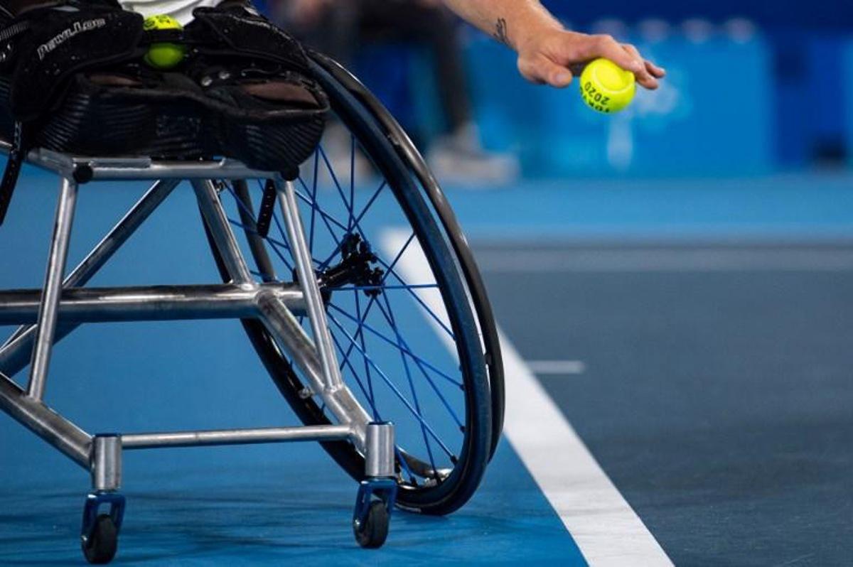 France's Nicolas Peifer serves against Britain's Alfie Hewett and Gordon Reid during their men's doubles gold medal match at the Tokyo 2020 Paralympic Games at Ariake Tennis Park in Tokyo on September 3, 2021. Philip FONG / AFP