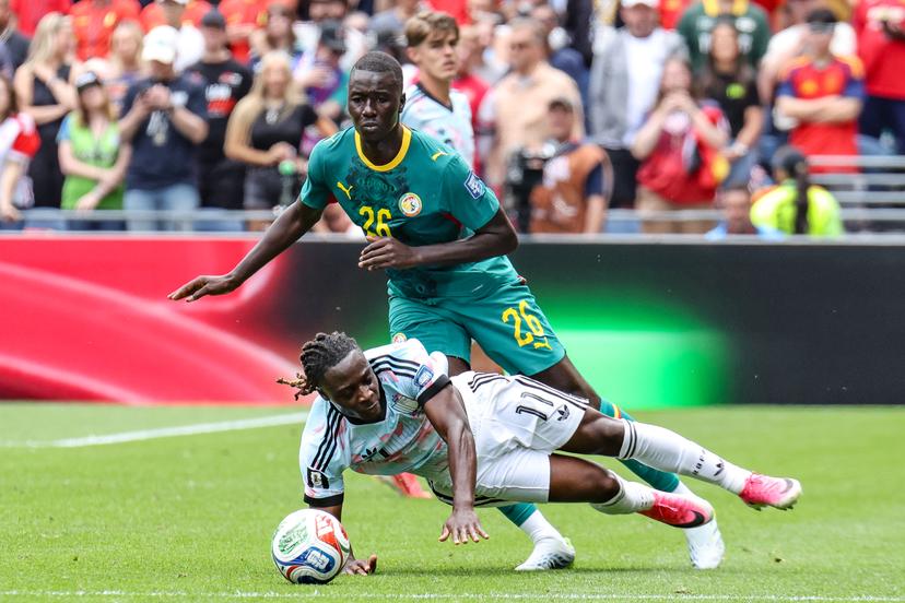 Belgium's Jeremy Doku and Senegal's Pape Gueye fight for the ball during a soccer game between Belgian national team Red Devils and Senegal, on Wednesday 01 July 2026, at the Seattle Field, in Seattle, a 1/16 finals game in the FIFA World Cup 2026. BELGA PHOTO BRUNO FAHY