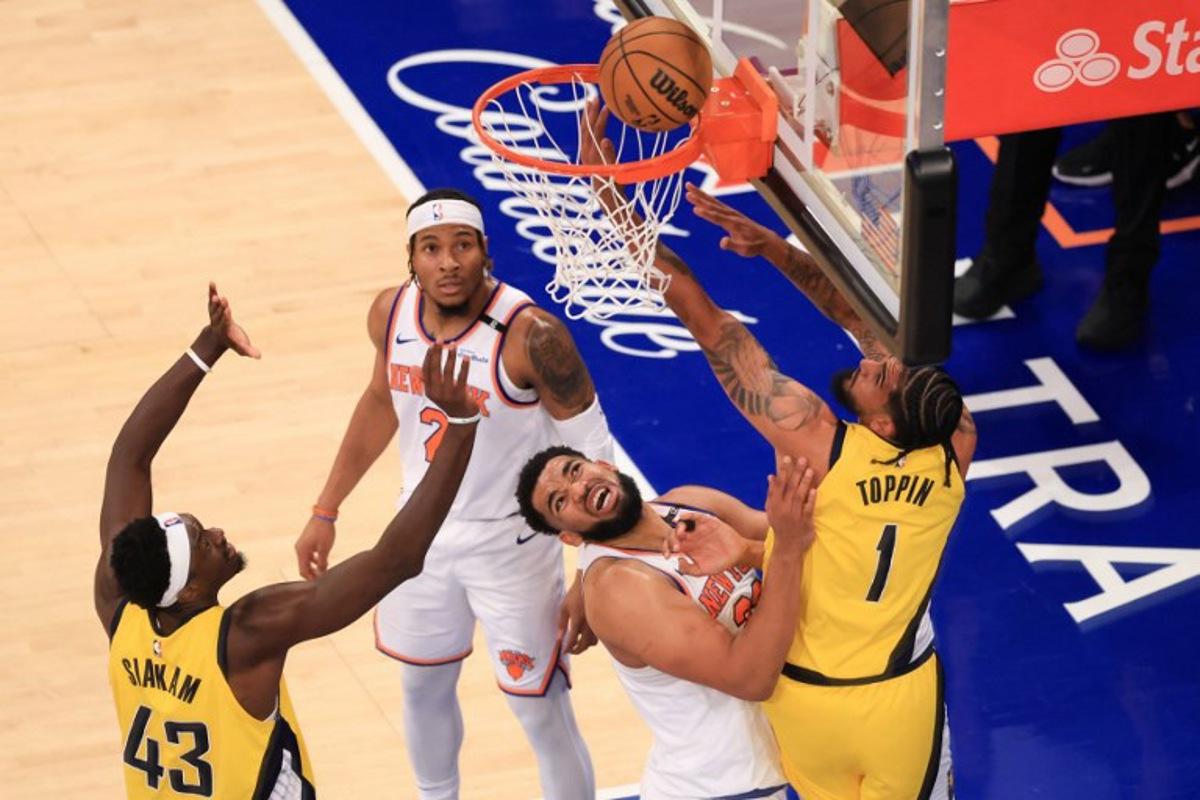 Knicks' center #32 Karl-Anthony Towns and Pacers' power forward #01 Obi Toppin fight for the ball during Game Five of the Eastern Conference Finals of the 2025 NBA Playoffs between the New York Knicks and the Indiana Pacers at Madison Square Garden in New York on May 29, 2025. CHARLY TRIBALLEAU / AFP