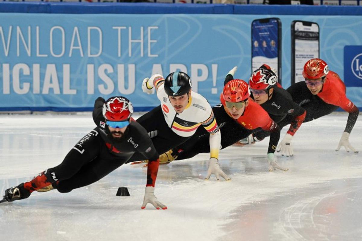(L-R) Canada's Steven Dubois, Belgium's Stijn Desmet, China's Lin Xiaojun, Canada's Jordan Pierre-Gilles and China's Sun Long compete in the Final A of the men's 500m at the ISU World Cup Short Track Speed Skating event in Beijing on December 10, 2023. Jade Gao / AFP