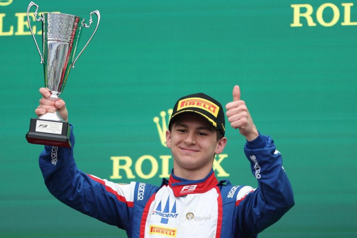 Second-placed Trident's Italian driver Leonardo Fornaroli celebrates on the podium after the Australia Formula 3 Grand Prix at the Albert Park Circuit in Melbourne on March 24, 2024. Martin KEEP / AFP