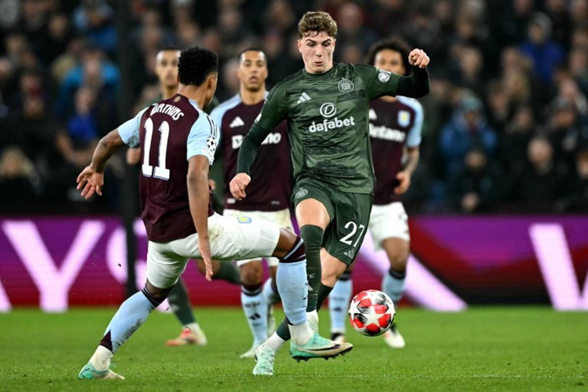 Celtic's Belgian midfielder #27 Arne Engels battles for the ball with Aston Villa's English striker #11 Ollie Watkins during the UEFA Champions League football match between Aston Villa and Celtic at Villa Park in Birmingham, central England on January 29, 2025. JUSTIN TALLIS / AFP