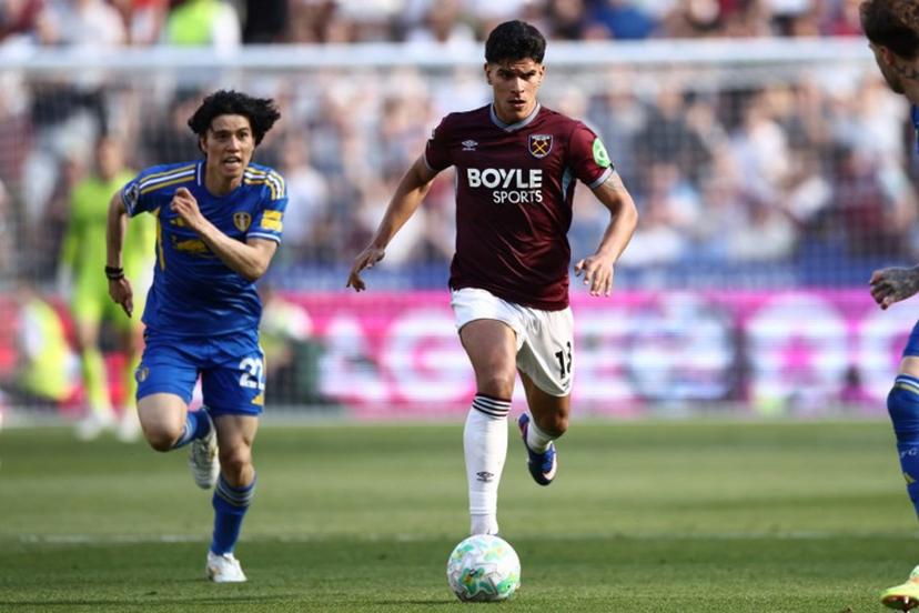 West Ham United's Portuguese midfielder #18 Mateus Fernandes runs with the ball during the English Premier League football match between West Ham United and Leeds United at the London Stadium, in east London on May 24, 2026. Henry NICHOLLS / AFP