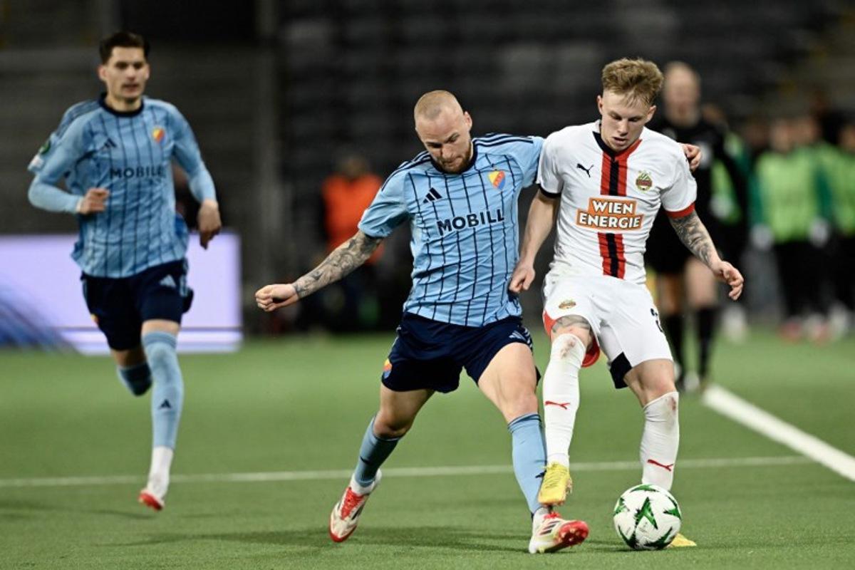 Djurgarden's Adam Stahl and Rapid Vienna's Isak Jansson vie for the ball during the quarter-final Conference League football match 1 of 2, between Djurgarden and SK Rapid Vienna in Stockholm on April 10, 2025. Pontus LUNDAHL / TT NEWS AGENCY / AFP