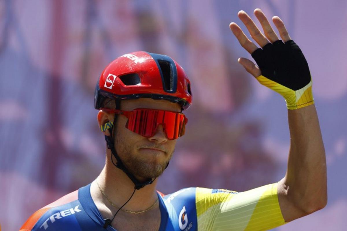 Lidl - Trek Italian rider Jonathan Milan waves during the presentation prior the 4th stage of the Giro d'Italia 2026 - Tour of Italy cycling race between Catanzaro and Cosenza, Italy, on May 12, 2026. Luca Bettini / AFP