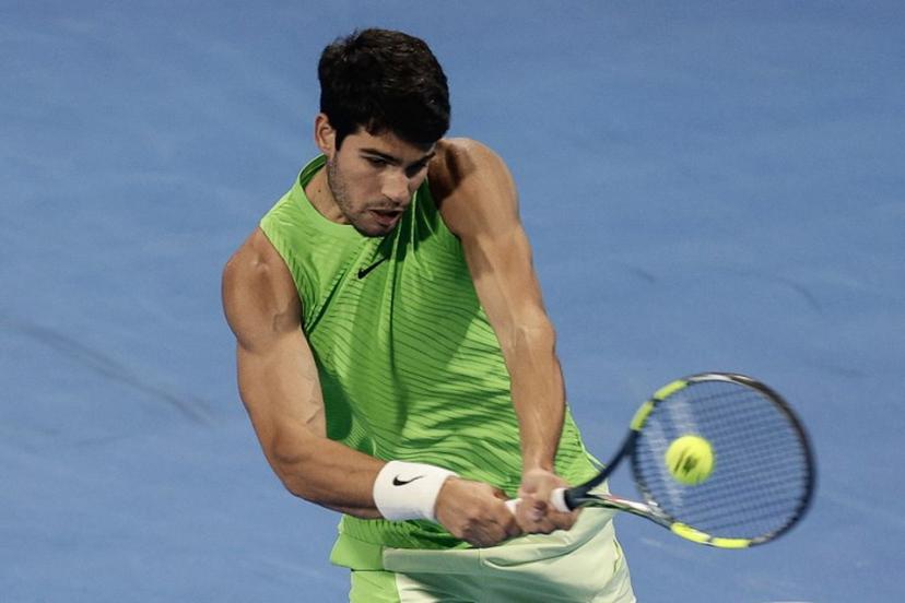 Spain's Carlos Alcaraz hits a return against France's Arthur Fils during their men's singles final match at the Qatar Open tennis tournament in Doha on February 21, 2026. Karim JAAFAR / AFP