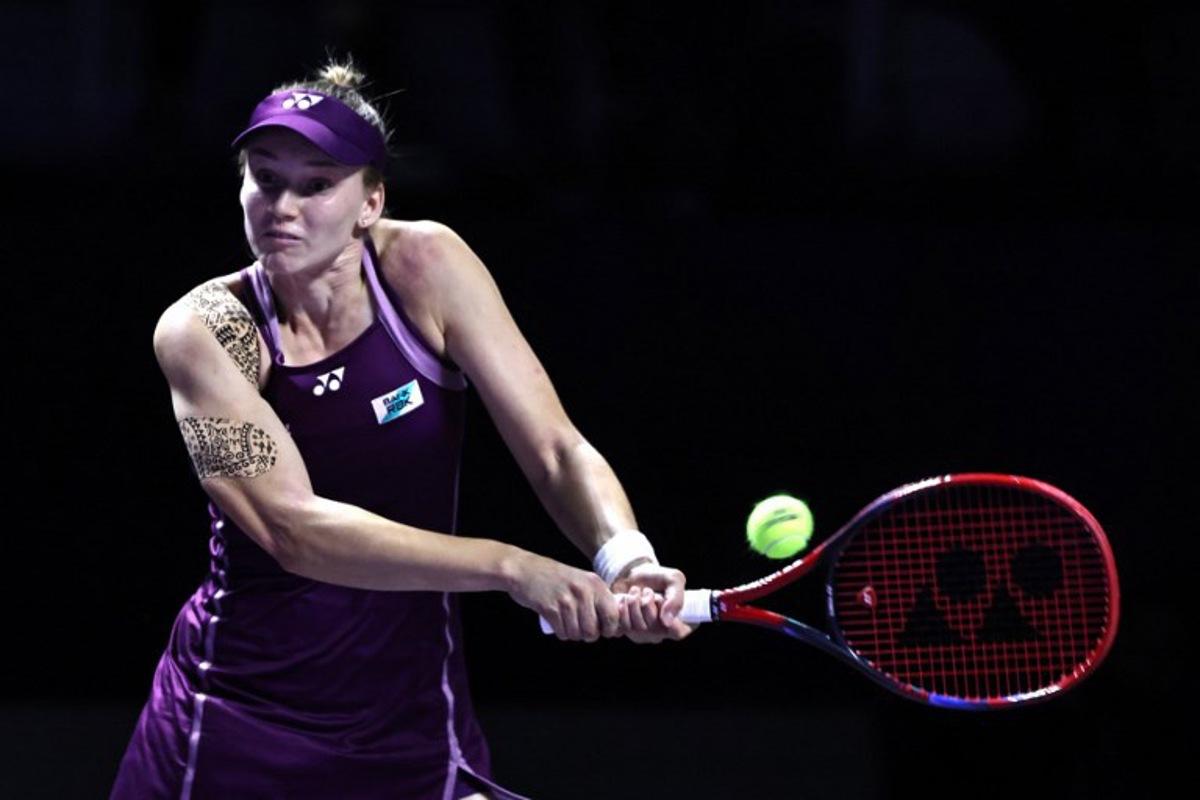 Kazakhstan's Elena Rybakina returns the ball to Russia's Ekaterina Alexandrova during their WTA Finals tennis tournament in Riyadh on November 5, 2025. Fayez NURELDINE / AFP